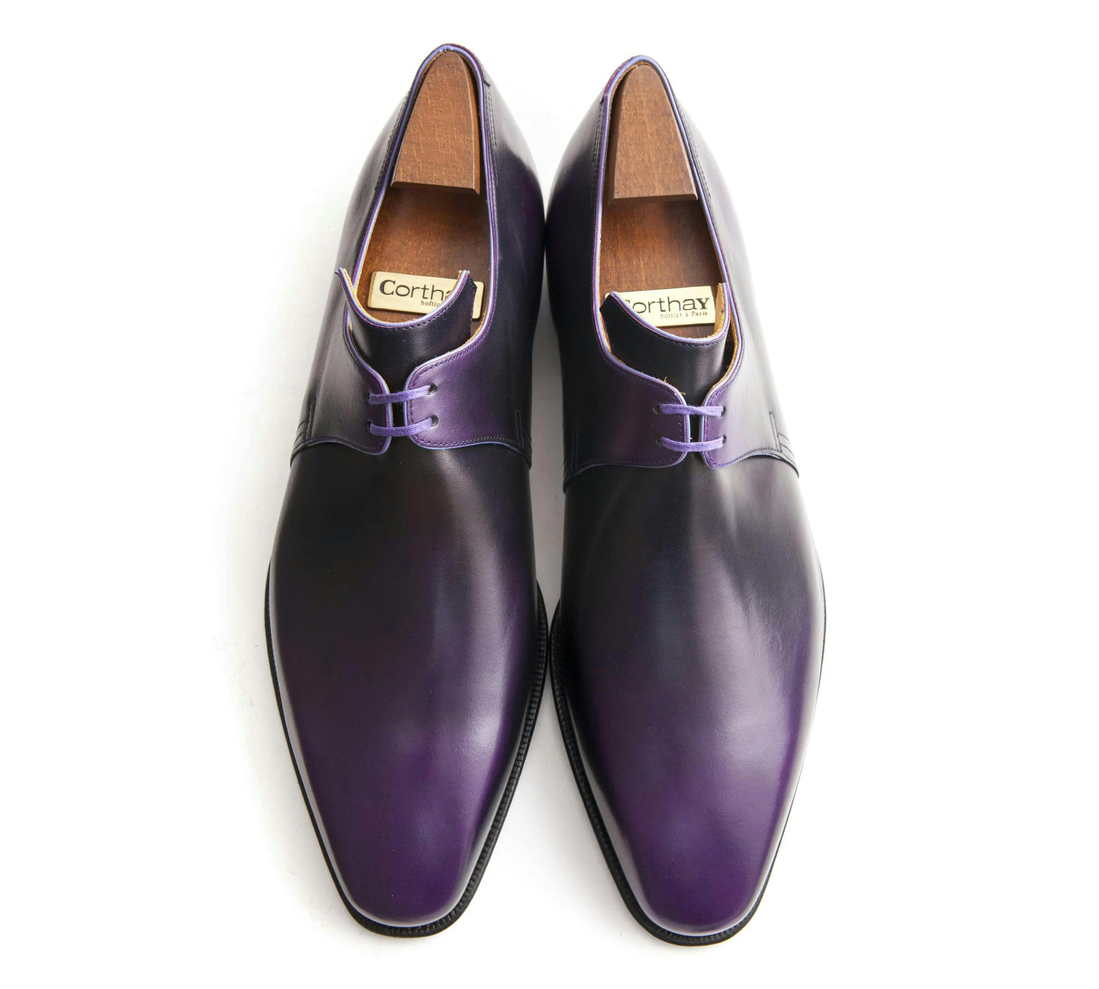 Top view of a Corthay Arca in aubergine calfskin.