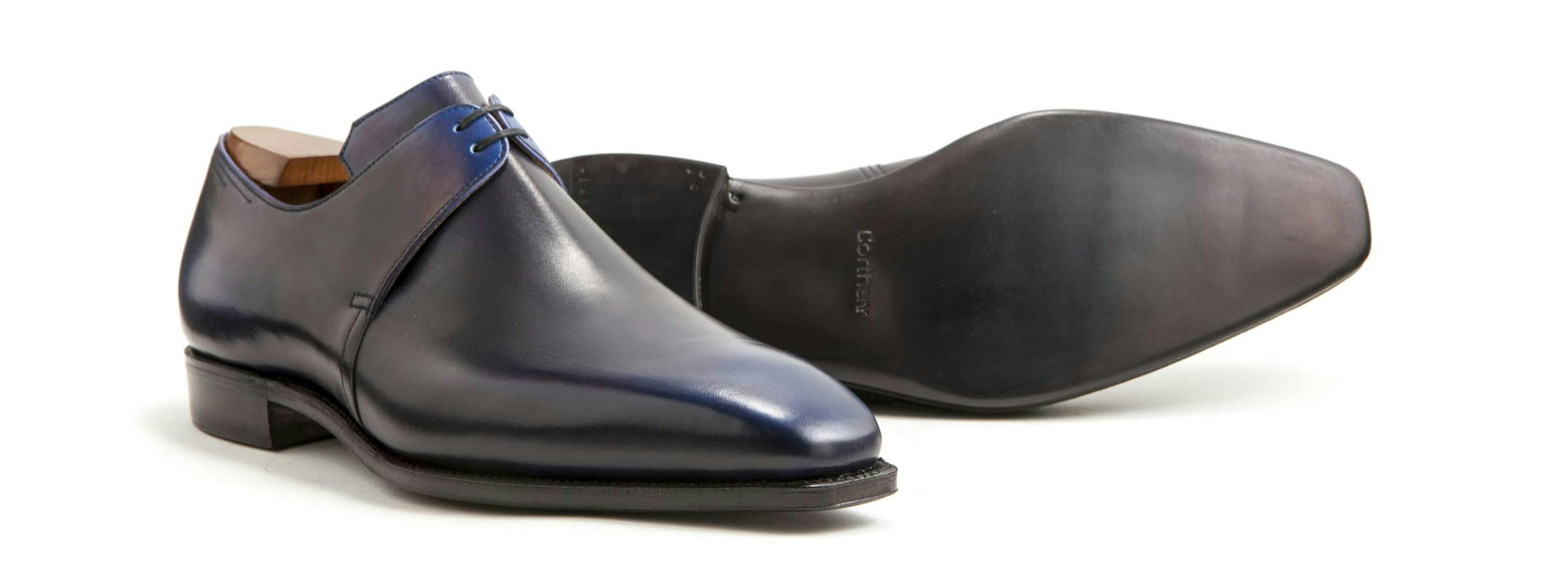 Corthay Arca in blue calfskin, with a view of its leather soles.