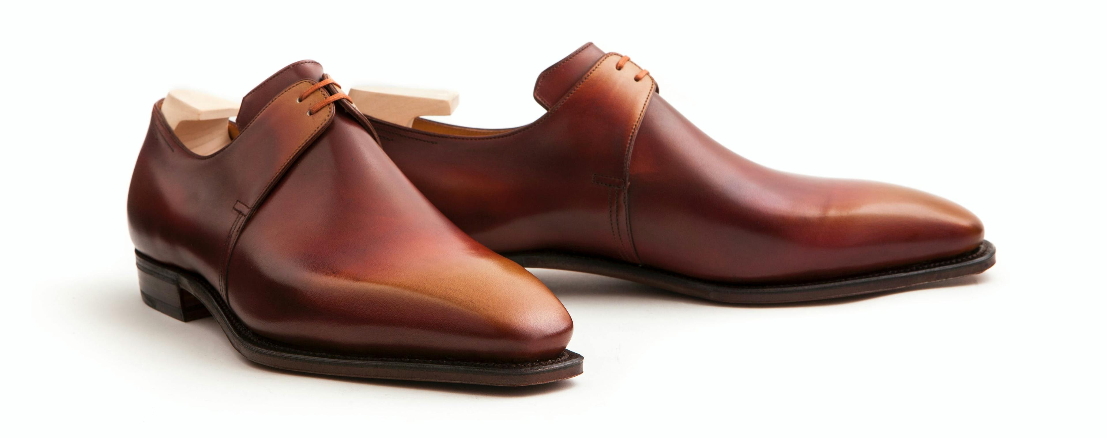 Front view of a Corthay Arca in caramel calfskin.